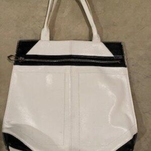 White and black leather shoulder bag with beautiful fucshia interior